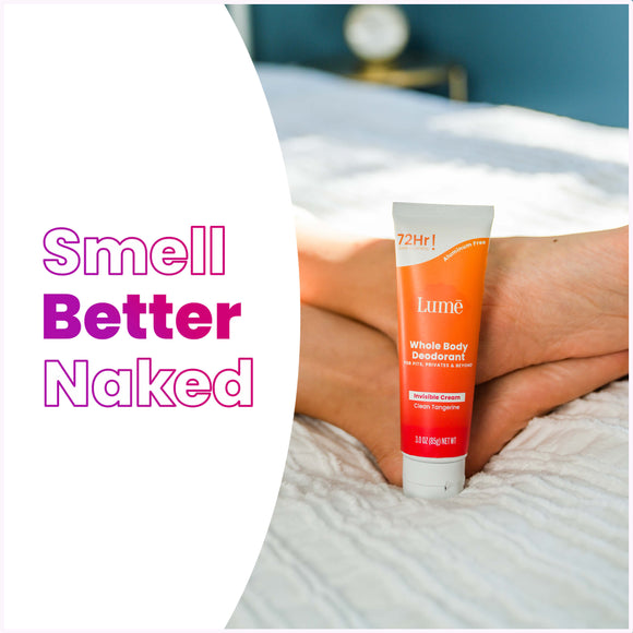 Lume-clean-tangerine-cream-deodorant-tube-on-a-white-comforter-next-to-a-persons-feet-and-the-text_-smell-better-naked-1.jpg