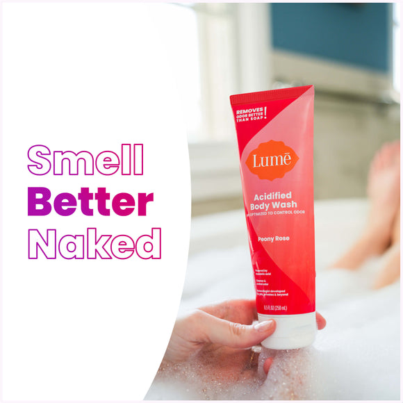 Woman-taking-a-soapy-bath-holding-a-Lume-peony-rose-scented-acidified-body-wash-and-the-text_-smell-better-naked.jpg